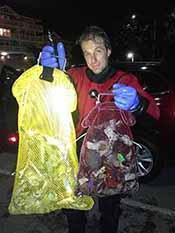ODA Volunteer Steve Millington with 2 bags of plastic trash