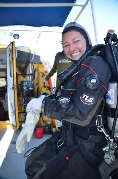 ODA Volunteer Diver Kim Cardenas suiting-up on the deck of our conservation vessel