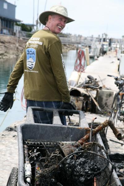 Ocean Defender Jim Lieber hauling cart full of ocean debris.