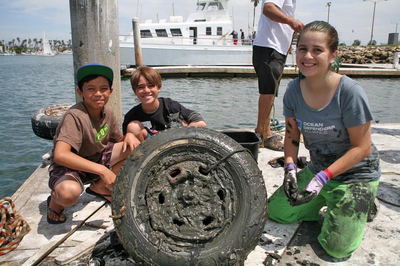 Ocean Defenders team with recovered icean debris - a tire