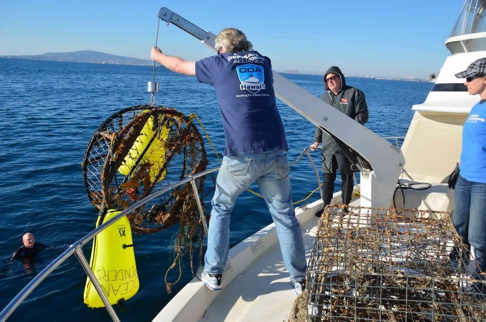 Abandoned crab pot is removed