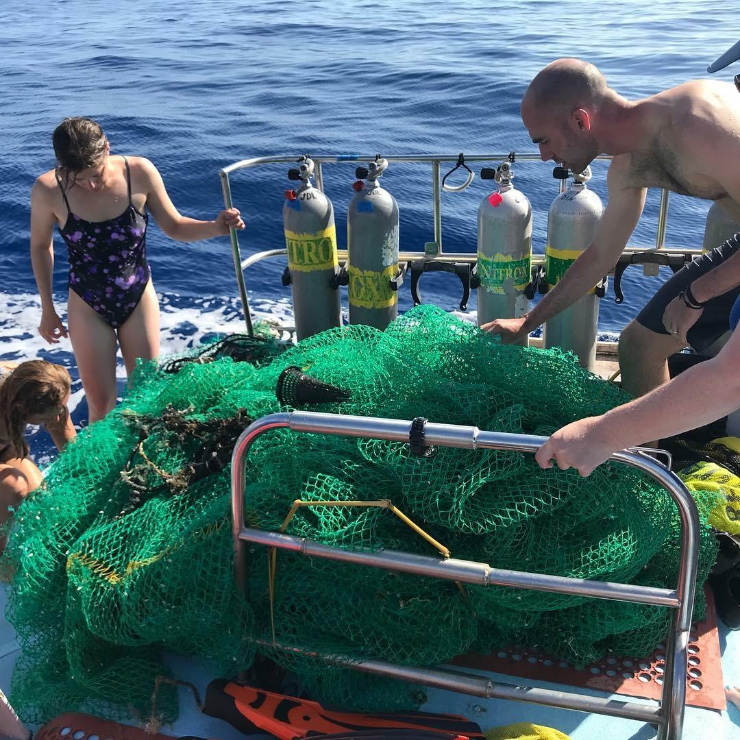 Crew removes live animals from ghost net