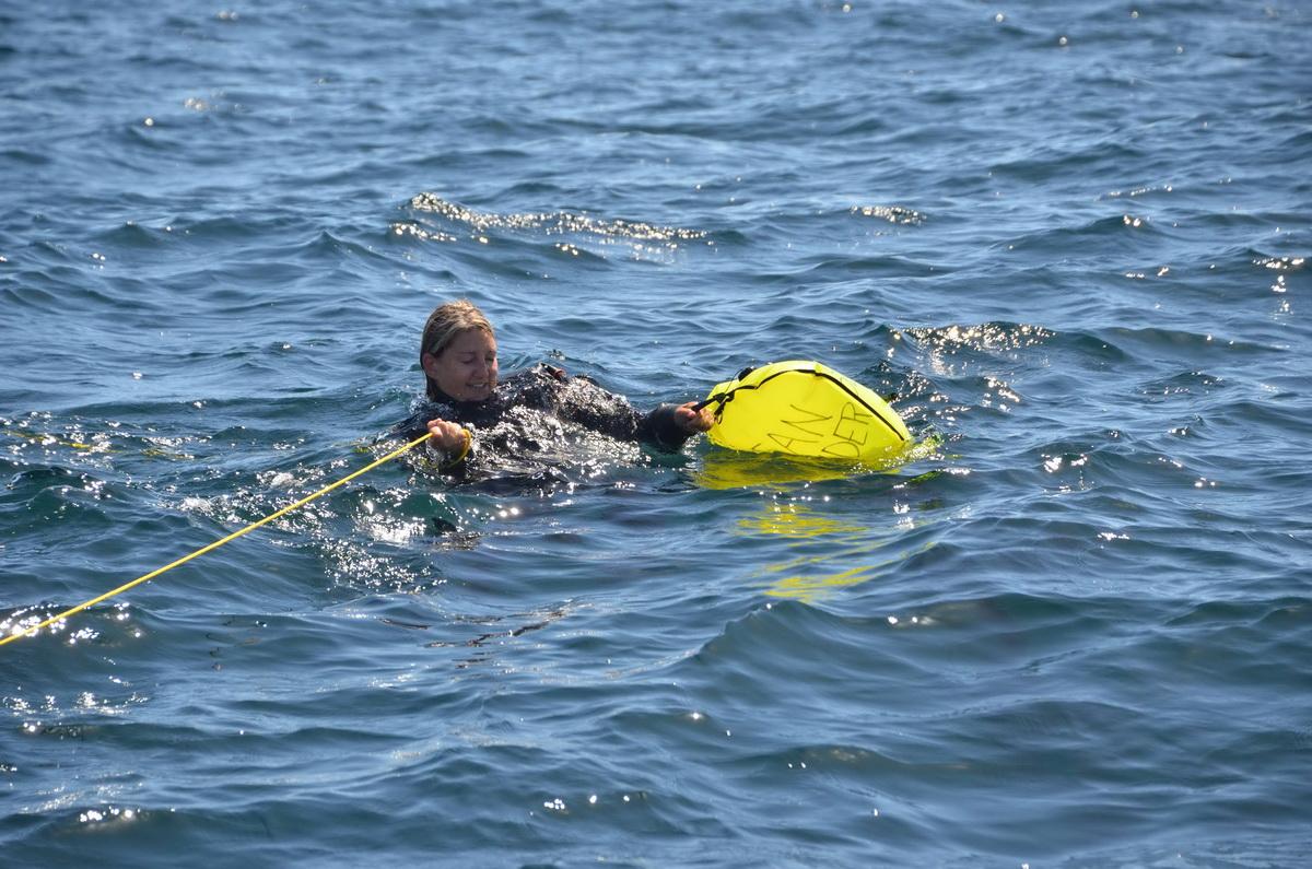 Ocean defender diver hauls debris