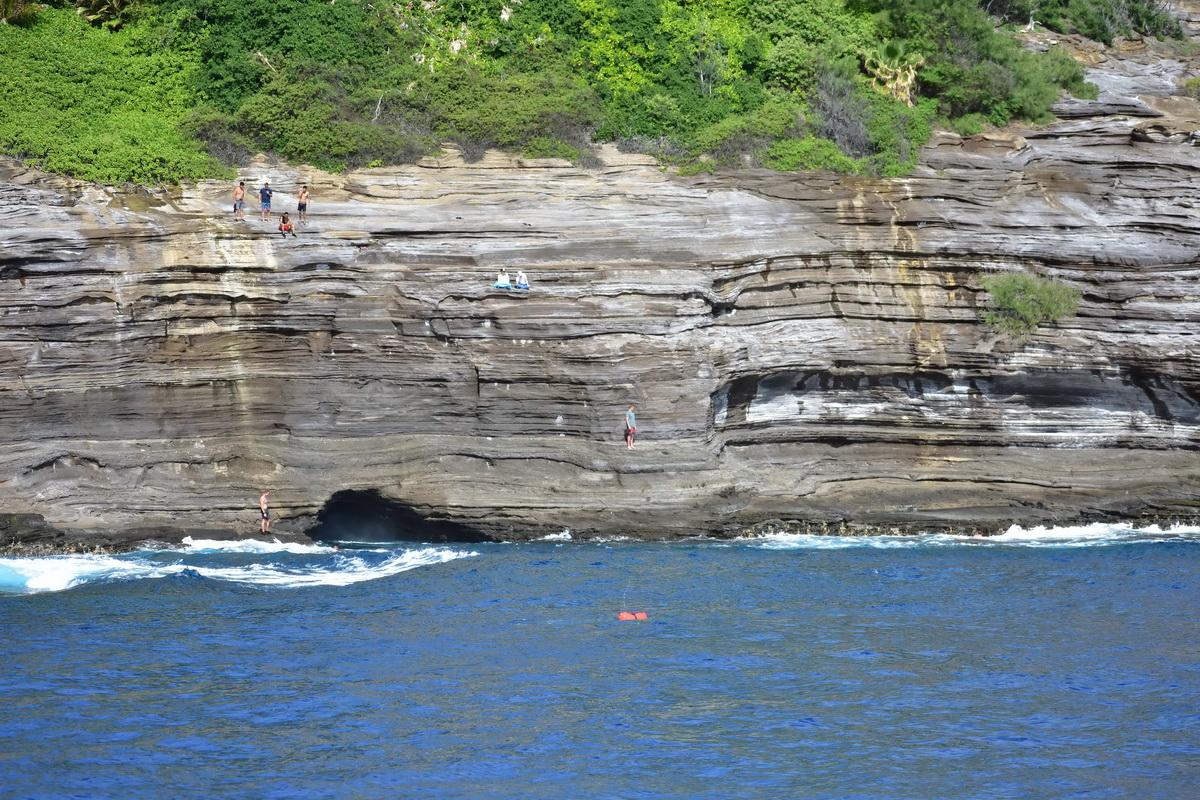 Cliff with fishermen on it