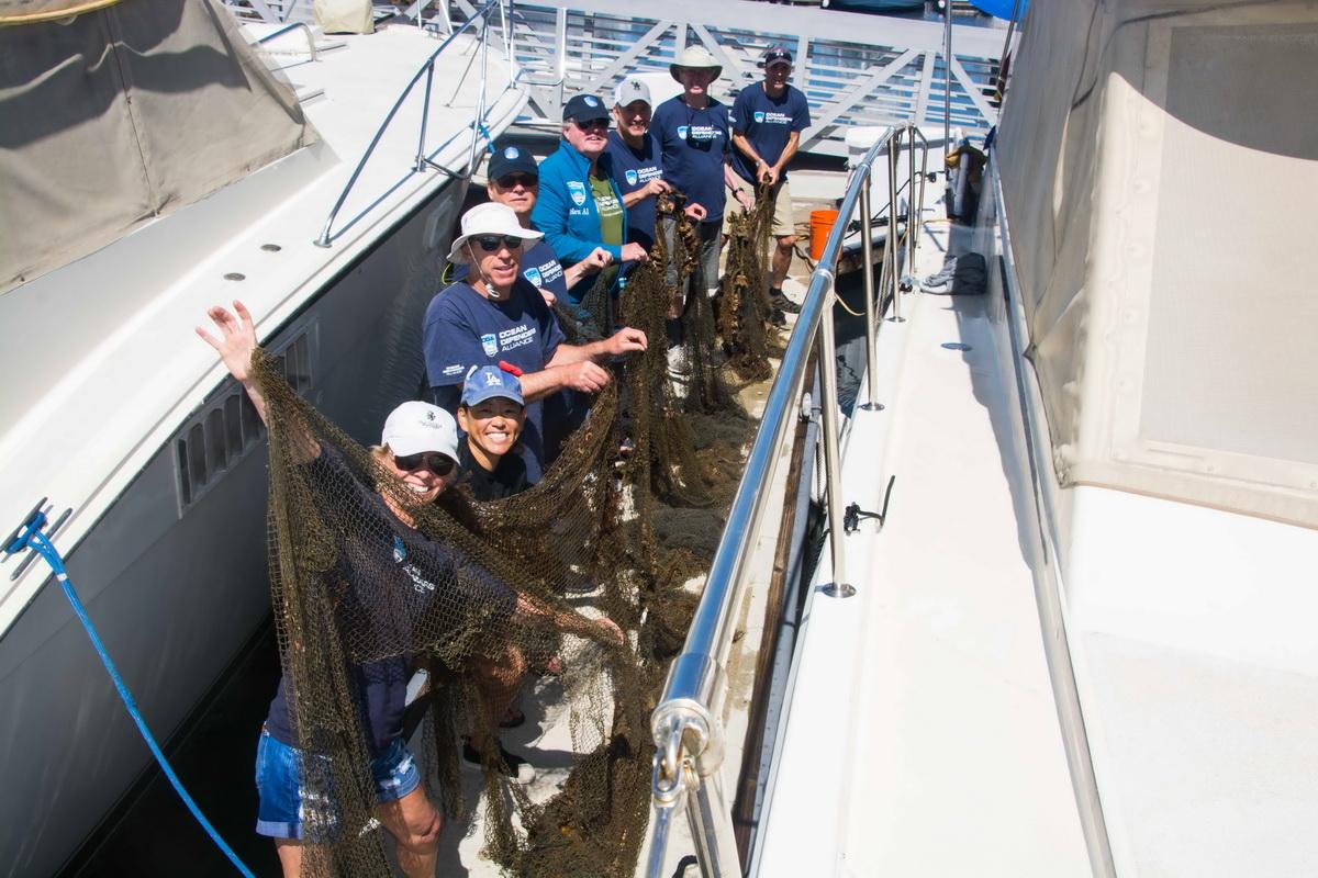 ODA volunteer crew with squid net they removed