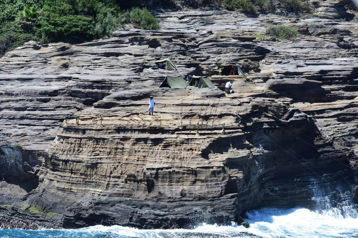 Cliffs with men fishing