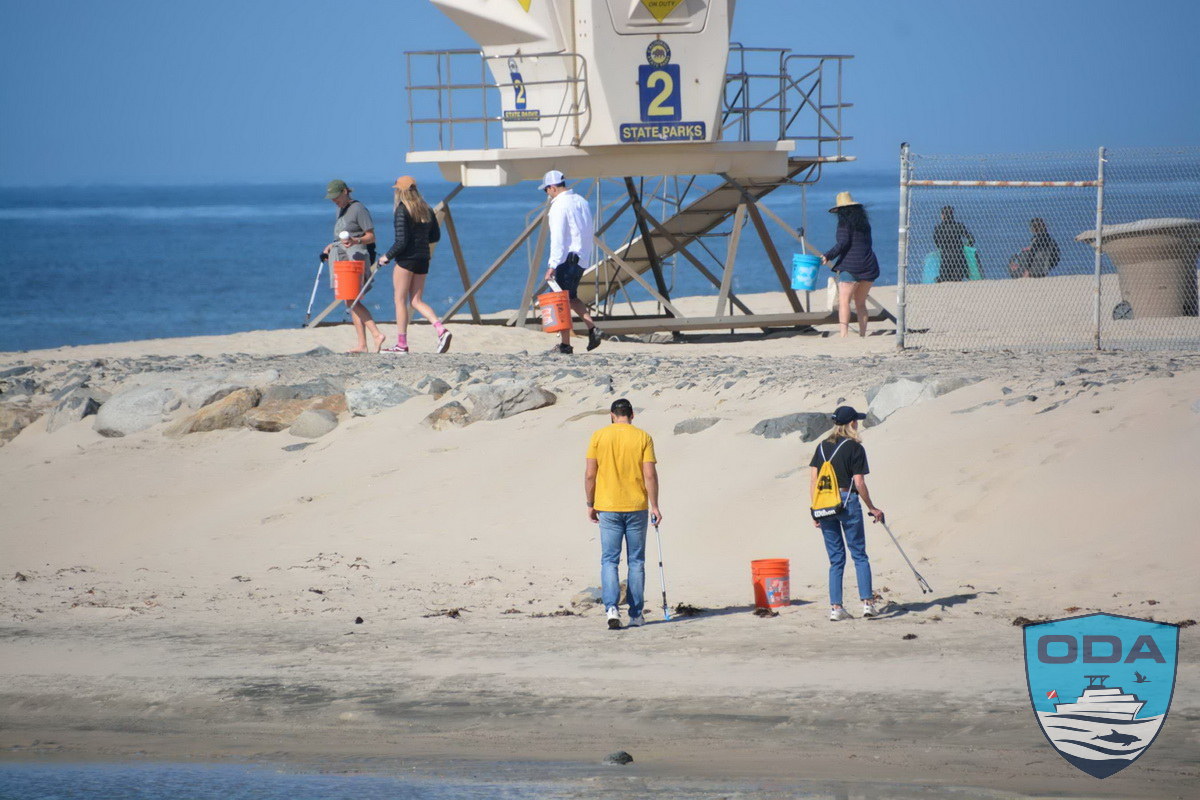 Volunteers scour beach for trash and plastics