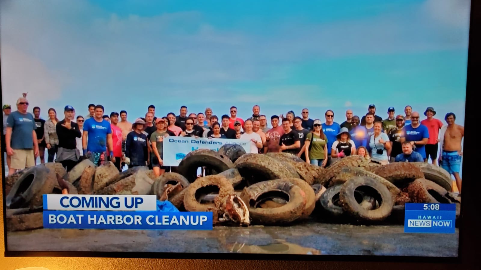 KHON covers the cleanup, crew gathers for photo