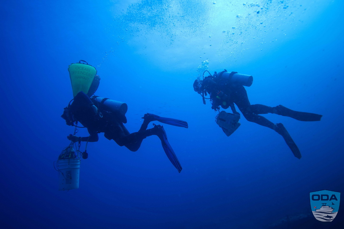  UW Divers with debris float bags