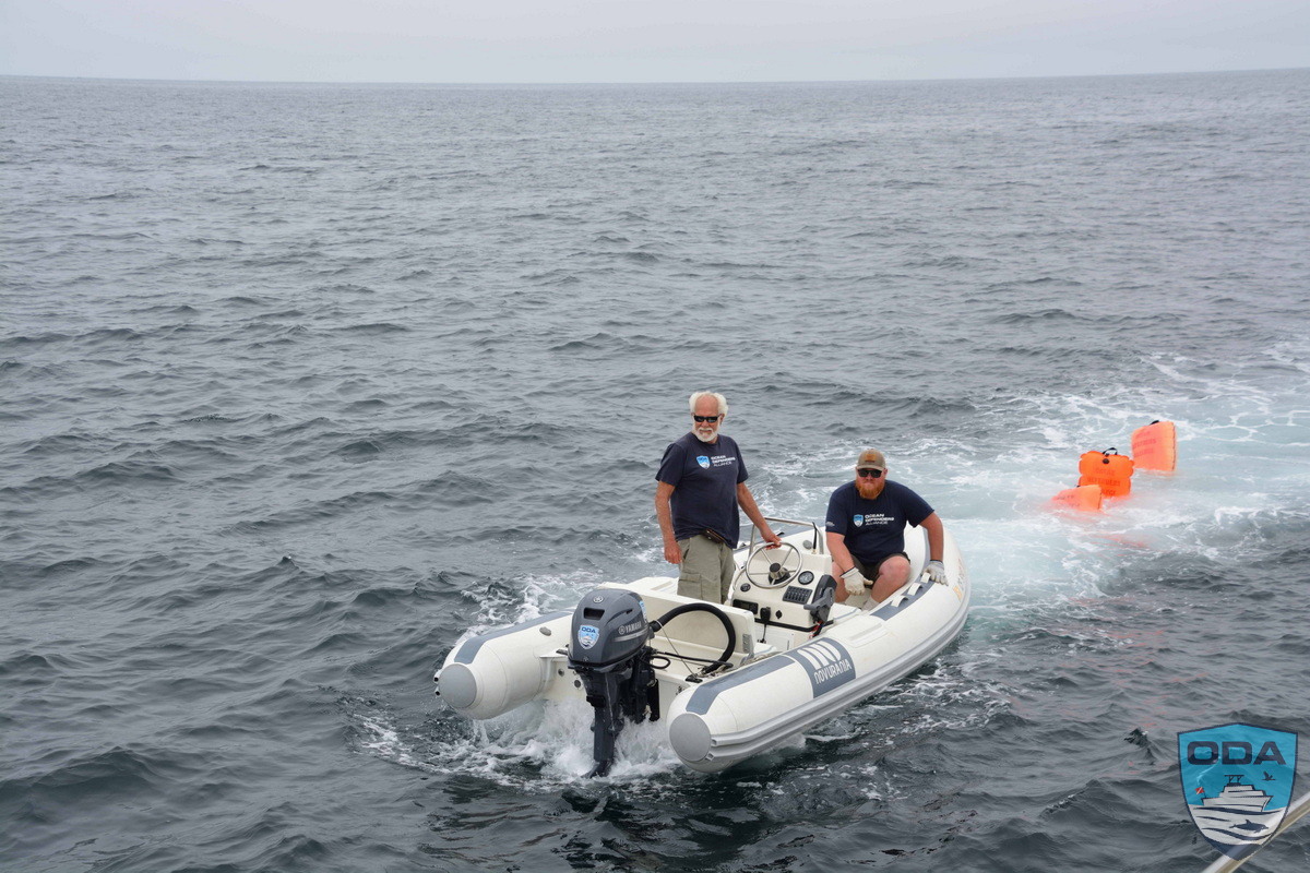 The ODA RIB team tows back the debris that was attached to three float bags!