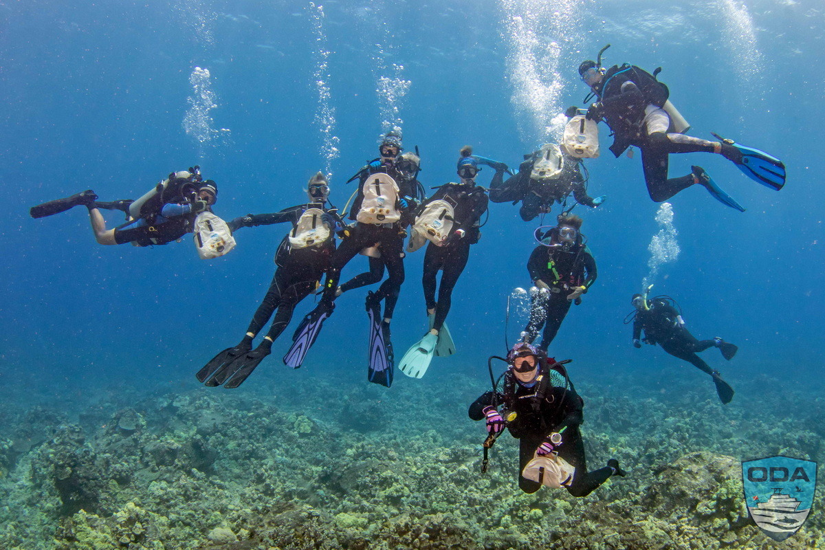 Divers with their ODA ocean debris collection bags