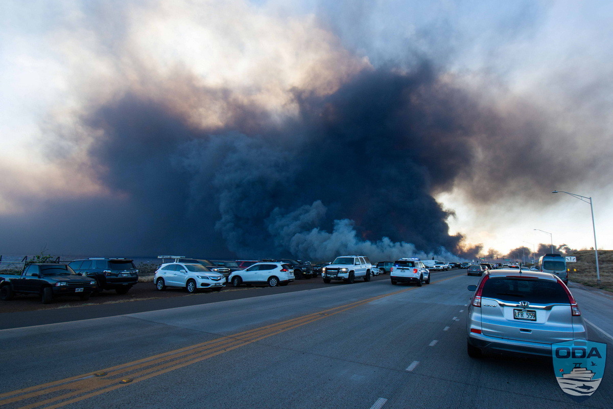 Cars pull over as Lahaina wildfire burns in the distance