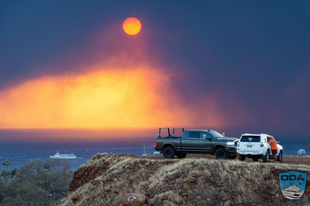 The orange ball of the sun can be seen through the smoke