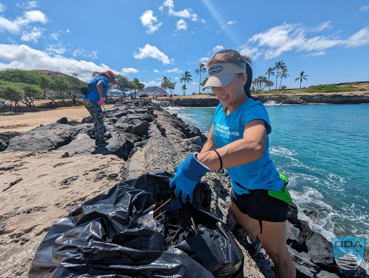Shore crew bags up garbage