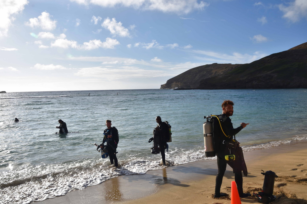 Divers entering water