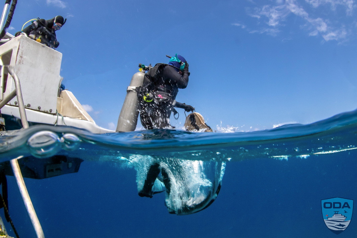 Ocean Defenders SCUBA Diver jumps into the ocean to remove ghost gear